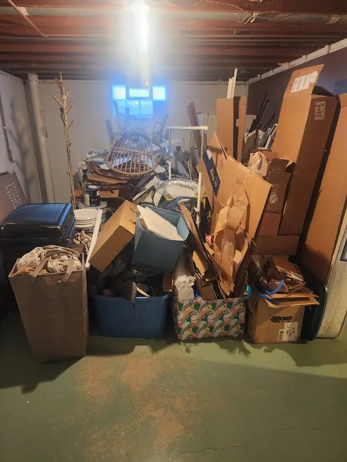 Roll-off dumpster container at job site for 4 Yard Dumpster Rental in Millington